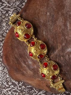 Vintage bracelet in gold metal and red resin, from Chorange. Signed on the back, 100% authentic. In perfect vintage condition. Certificate of authenticity on request. Ancient Roman Jewelry, Vintage Haute Couture, Roman Jewelry, Goddess Jewelry, Tibetan Jewelry, Red Jewelry, Vintage Bracelet, Bracelet Vintage, Jewelry Inspo