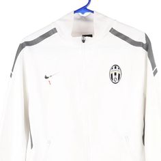 Description:Vintage Age 18 Juventus white Nike track jacket, fits x-large.GENDER: boys CONDITION: good - logo fading on front.STYLE: track jacketERA: 1990sCOLOUR: whiteFABRIC: polyester White Long Sleeve Track Jacket For Sports Season, White Long Sleeve Track Jacket For Sports, White Hooded Outerwear For Sports Events, White Sports Outerwear With Three Stripes Branding, 90s White Sports Outerwear, White Long Sleeve Sports Track Jacket, White Outerwear For Sports Events And Season, White Track Jacket With Three Stripes For Sports Season, White Track Jacket For Streetwear