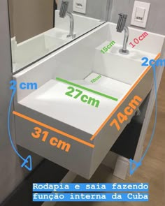 a bathroom sink sitting under a large mirror next to a wall mounted faucet