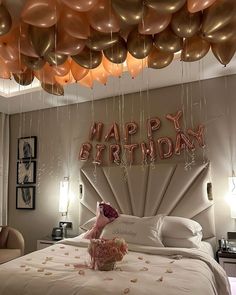 a bedroom decorated with balloons that say happy birthday