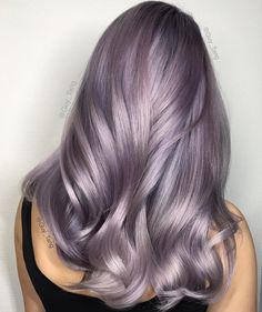 www.cosmopolitan.stfi.re beauty-hair hair news a44374 smokey-lilac-hair ?sf=yjeobne . Shiny glossy pastel lavender haircolor. With hints of pinks purples blues greys. Lilac Hair Color, Lavender Hair Colors, Lilac Hair, Hair Ombre