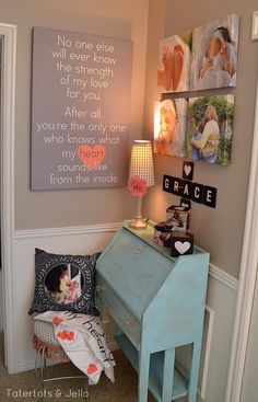 a blue piano sitting in the corner of a room next to pictures on the wall