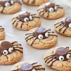 cookies decorated with chocolate spider eyes and googly eyes