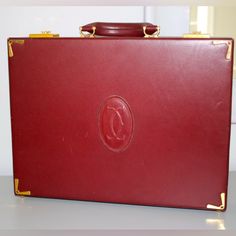 100% Authentic Measurements 16.50" X 13.00" X 3.50" Made In Paris. The Briefcase Is From The "Les Must" De Cartier Collection In Their Iconic Shade Of Burgundy Leather. The Document Holder Has Gold Plated Metal Accents And Is Decorated With The Cartier Monogram. It Has A Metal Plaque That Has Been Stamped "Les Must De Cartier Paris" Logo. The Bag Is In Excellent Condition, Very Clean, And Shows Very Minor Signs Of Wear From Normal Use. Classic Red Briefcase For Formal Occasions, Elegant Red Formal Briefcase, Luxury Red Briefcase For Formal Occasions, Red Rectangular Briefcase For Formal Use, Elegant Red Travel Briefcase, Elegant Red Briefcase For Travel, Vintage Formal Briefcase With Gold-tone Hardware, Cartier Collection, Paris Logo