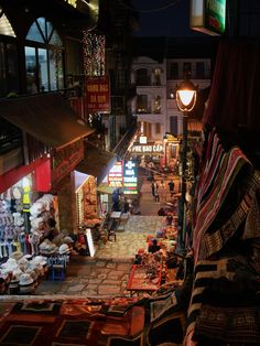 an aerial view of a street market at night