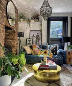 a living room filled with furniture and lots of plants