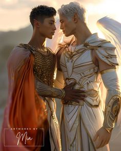 two men dressed in white and gold standing next to each other with wings on their shoulders