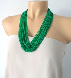 "This stunning kelly green necklace is perfect for that summer dress, beach wedding, date night, and many more special occasions. Available with silver or gold clasp. It looks very elegant and the color is very classic It has 24 strands. Please read specifications on SIZES below. This item comes in several sizes. Kindly choose at checkout. You can use the diagram on the pictures as a reference, but keep in mind that we all have different neck and body sizes so I recommend you measure yourself to Summer Dress Beach, Green Statement Necklace, Necklace Green, Jewelry Essentials, Seed Bead Necklace, Black Necklace, Green Necklace, Stunning Necklace, Multi Strand Necklace