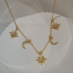 This charm necklace features moon and star charms. Our minimalist jewellery is designed to be worn alone or stacked with other gold necklaces and chains. Minimalist celestial necklaces look beautiful and make many any outfit look chic and effortless. We make our jewellery in small batches to reduce wastage. Our jewellery is designed with the modern Woman in mind, elegant, unique pieces with a classic touch. Our jewellery is great for gifting, whether it's Valentines, Mothers Day, Birthday or sim Celestial Star-shaped Necklace With Adjustable Chain, Celestial Yellow Gold Charm Necklaces With Star Charm, Celestial Pendant Necklace Gift For Her, Celestial Yellow Gold Charm Necklace With Star Charm, Celestial Pendant Necklace As A Gift For Her, Celestial Yellow Gold Charm Necklace With Adjustable Chain, Everyday Celestial Necklace With Star Charm, Gold Necklace With Moon Charm And Star Shape, Celestial Yellow Gold Necklace With Star Charm