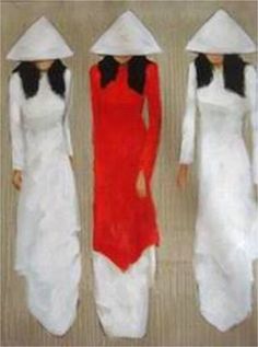 three women in white and red dresses standing next to each other