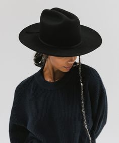 Ezra blends statement fashion with Western. A classic cattleman crown made to be styled for the city as much as the countryside. This hat features an upturned brim + a tall crown, giving Ezra a modern + feminine feel. Ezra comes with a removable tonal grosgrain band featuring a brass Gigi Pip pin. Other bands pictured are sold separately. Fall Flat Brim Top Hat, Rigid Brimmed Winter Hat, Fall Fedora Panama Hat For Rodeo, Fall Rodeo Fedora Panama Hat, Rigid Fedora Hats For Rodeo, Everyday Fall Fedora With Flat Brim, Everyday Fall Flat Brim Fedora, Elegant Winter Ranch Hat, Fall Brimmed Panama Hat For Rodeo