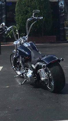 a black motorcycle parked in a parking lot