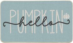 a blue door mat with the word pumpkin written in black ink on it's side