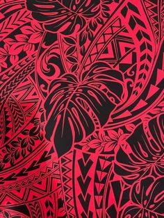 a red and black background with many different designs on it's surface, including leaves