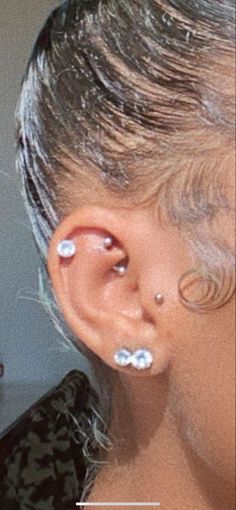 a woman with piercings on her ears