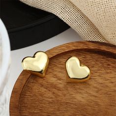 Solid 18k gold-plated heart stud earrings. 0.74" W x 0.66" H 18k gold-plated copper