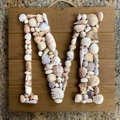 the letter m is made out of seashells