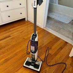 a vacuum is on the floor in a room