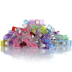 a pile of assorted colored hair clips