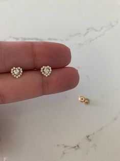 "14K Heart Cubic ZC Earrings, Dainty Earrings | Women Earrings | Kid Earrings | Gold Hearts | Push Back Studs | Gold Heart Earrings | Dainty Studs | Free Shipping Beautiful, elegant and classic heart cut studs ♦ Materials: 14K Gold, Cubic Zirconia ♦ Available colors: 14K Yellow Gold ♦ Closure: Push Backs ♦ Earrings Measurements: 5 Millimeters -------------------------------------------------- ♦ -------------------------------------------------- MATERIALS 14K Gold PRODUCTION TIMES Order processin Heart-shaped Rose Gold Earrings With Diamond Accents, Heart Shaped Rose Gold Earrings With Diamond Accents, Fine Jewelry Heart Earrings For Pierced Ears, Gold Heart-shaped Diamond Earrings For Wedding, Heart-shaped Fine Jewelry Earrings For Pierced Ears, Heart-shaped Earrings For Anniversary, Heart-shaped Fine Jewelry Earrings, Heart Cut Pierced Earrings For Wedding, Pierced Heart Cut Earrings For Wedding