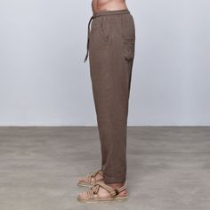 Bronze %100 Linen Dropped-crotch Tapered Pant 🌿 ️ 🌾 %100 Linen,  Dropped-crotch,  Tapered leg,  Elastic Waisband,  Front tie fastening,  Two rear patch pockets, Two side pockets,  Double Fold Hem +Care Instructions Dry cleaning is recommended. Do not bleach. Do not steam.        Model is wearing size Medium.             Height: 1.88m. Chest: 96 cm. Waist: 75 cm. Hips: 95 cm.              Available in Men Sizes: S-M-L-XL-XXL       Care Instructions: Machine washable at 30 degrees. Do not bleach Linen Pants For Men, Drawstring Pants Men, Pants For Man, Pants For Men Casual, Tapered Pant, Men Yoga, Minimalist Outfits, Mens Linen Pants, Linen Clothing