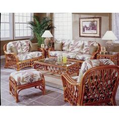 a living room filled with lots of furniture and decor on top of tile flooring