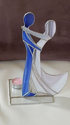 a blue and white figurine sitting on top of a table