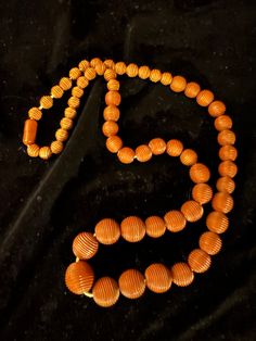 Vintage Bakelite necklace with graduated dark caramel color striated beads. Could use restringing but not necessary. Rare find. Vintage Orange Necklace With Wooden Beads, Vintage Brown Hand-strung Beaded Necklace, Formal Brown Necklace With Round Beads, Vintage Single Strand Brown Necklace, Vintage Brown Single Strand Necklace, Vintage Orange Wooden Beads, Brown Single Strand Necklace With Round Beads, Vintage Brown Single Strand Beaded Necklace, Amber Necklace With Round Wooden Beads