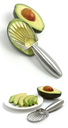 an avocado cut in half on a plate with a spatula next to it