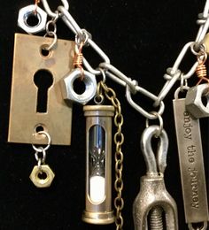 "This is an absolutely, never to be duplicated, long, heavy, steampunk, multi, charm necklace created by \"K\" Designs.  I have incorporated vintage and new items in this one-of-a-kind piece including a pully, hourglass, keys, key hole, nuts, bolts, chains and a tag that says \"Enjoy the journey.\"  It is a long necklace measuring 31 inches and it is designed in a bib style with the vintage pully as the center pendant.  The necklace has been finished with a toggle clasp. If you like punk then you will love this, just be aware that it is heavy.  Please be sure before purchasing as this item is not returnable.  Check out my other handcrafted punk necklaces in my Etsy shop.  This item will require a signature upon delivery." Key Charm Necklace, Nuts & Bolts, Enjoy The Journey, Hand Thrown Pottery, Recycled Items, Key Necklace, Copper Metal, Key Hole, Toggle Clasp