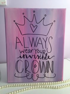 a pink and purple sign with a crown on it that says always wear your invisible crown