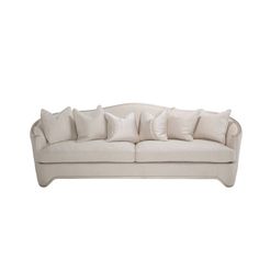 a white couch with lots of pillows on it's back and arms, against a white background