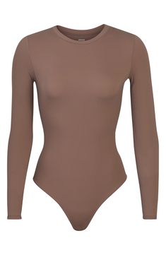 Sculpt your body's natural shape with a long-sleeve bodysuit from Kim Kardashian's SKIMS that holds you in and lifts you up in all the right places. Reflecting the brand's passion for highly technical shapewear solutions for every body, this everyday piece has a whisper-soft, seamless construction, high-cut legs and a thong back that remains invisible under clothing. Crewneck Long sleeves Snap gusset 79% polyamide, 21% spandex Machine wash, dry flat Imported Fashion Capsule Wardrobe, Fashion Capsule, Plaid Blazer, Long Sleeve Bodysuit, High Cut, Kim Kardashian, Shapewear, Capsule Wardrobe, Nordstrom