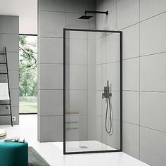 a bathroom with a walk in shower next to a green stool and white tiled walls