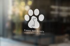 the logo for paros vet clinic is displayed on a glass door with an image of a cat's paw