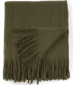 an olive green blanket with fringes on it