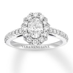 a diamond engagement ring with the words vera wang love on it's side