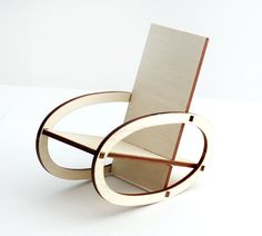 a chair made out of plywood and wood on a white surface with no one around it