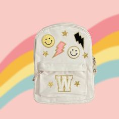 "Customizable kids / toddler natural colored canvas backpack / iron-on patches  THIS IS NOT A STANDARD SIZE BACKPACK PLEASE READ DIMENSIONS Includes patches shown with your choice of initial letter Dimensions:  -Width: 9 3/4\" -Height: 12 3/8\" -Length: 3\" **spot clean only" Stoney Clover Backpack Ideas, School Backpack With Logo Patch, School Bag With Letter Patch For Back To School, School Bags With Letter Patch For Back To School, Standard School Backpack With Logo Patch, Back To School Bags With Letter Patch, White Canvas Backpack For Back To School, Trendy Backpack For School Events, White Customizable Backpack For Students