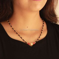 Italian Coral with an 18-inch mangalsutra with gold plating. A simple and delicate mangalsutra chain with a pearl combination for perfect daily use. It looks pretty with traditional and fancy outfits. I have more delicate designs in gold plating and in sterling silver as well. Please go through the mangalsutra section once. I do accept custom designs; kindly message me with your queries. Length - 17 inches Coral Black Beads Jewellery, Black Beads Mangalsutra Design Simple Short, Pearl Mangalsutra Designs, Black Beeds Chain Indian Gold Short, Coral Beads Jewellery Indian, Coral Mangalsutra, Pearl Mangalsutra, Fancy Mangalsutra, Black Beads Chain