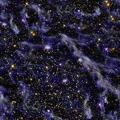 an image of some very pretty blue and yellow stars in the night sky with bright lights