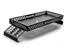 a black and white photo of a metal tray