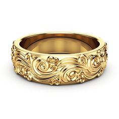 a gold wedding band with an intricate design