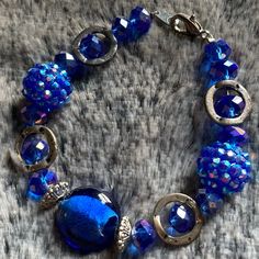 Blue Glass Bracelet W/Rhinestones & Silver Accents Length: 7 1/4” **All Bracelets Can Be Altered** Shorten In Length Possibly Lengthened Change To Magnetic Clasp Let Me Know Of Any Changes When Purchasing. Any Questions? Just Ask. Like An Item But Not The Price? Send An Offer. All Items In My Closet Are Buy 2 Get 1 Free. Elegant Blue Crystal Bracelet With Silver Beads, Blue Crystal Bracelet With Faceted Beads, Blue Crystal Bracelet For Party, Elegant Blue Crystal Beaded Bracelets, Silver Glass Beaded Bracelets For Parties, Blue Metal Bracelets With Round Beads, Blue Crystal Bracelet With Rhinestones For Party, Blue Metal Jewelry With Faceted Beads, Blue Glass Bracelet Jewelry