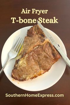 a piece of steak on a plate with a fork and knife next to it that says air fryer t - bone steak