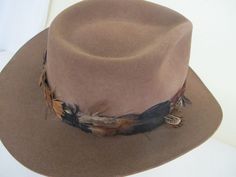 "Vintage Tiger of Sweden Outback Style Hat Made by Gil Truedsson Out of a ranch here in the Sierra's Top notch. For your steppin' out hat... Spectacular and extraordinary hat for the stylin' guy 5\" high 3\" brim. Feather hat band 23\" The color is a beautiful brown White satin lining Interior band is leather Excellent condition...barely worn Don't miss this one! Sharp! https://www.etsy.com/shop/BelindasStyleShop" Brown Top Hat For Kentucky Derby And Country Events, Vintage Brown Hat Bands For Country Events, Southern Style Brown Hat Bands For Rodeo, Southern Style Brown Hat Band For Rodeo, Vintage Hats For Western-themed Events One Size, Vintage Flat Brim Hunting Hat, Vintage Hats For Western-themed Events And Kentucky Derby, Vintage Felt Hat For Western-themed Events, Vintage Hat Bands For Outdoor Fall Activities