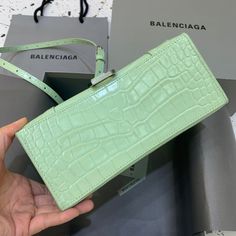 Description Balen Hourglass Small Handbag In Light Green, For Women, Bags 9in/23cm Rep 1:1 Size: 23 x 15 x 10 cm / 9 x 5.9 x 3.9 inches (Lenght x Height x Width) Handbag Curvilinear base One handle Adjustable and removable crossbody strap Studded magnet closure B logo hardware 1 back pocket 1 inner zipped pocket Includes box, dust bag. This product is of the best quality. Balenciaga Bag, Small Handbags, New Handbags, Satchel Bags, Fashion Handbags, Light Green, Designing Women, Contact Us, Wellness Design