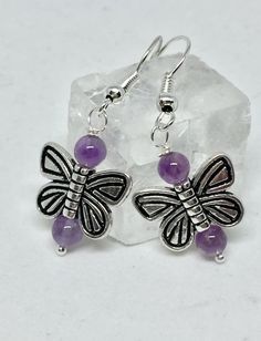 Amethyst butterfly earrings, amethyst earrings, amethyst jewelry, purple stone earrings, butterfly j Purple Earrings With Natural Stones, Purple Natural Stones Round Earrings, Round Purple Earrings With Natural Stones, Sterling Silver Drop Earrings With Butterfly Charm, Sterling Silver Jewelry With Butterfly Charm Drop Earrings, Amethyst Natural Stone Earrings For Gift, Amethyst Natural Stone Earrings As Gift, Amethyst Earrings With Natural Stones For Gift, Purple Butterfly Charm Earrings For Gift