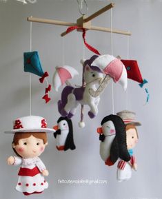 a group of stuffed animals hanging from strings