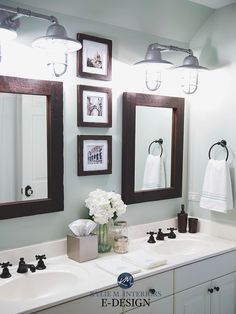 a bathroom with two sinks and three mirrors